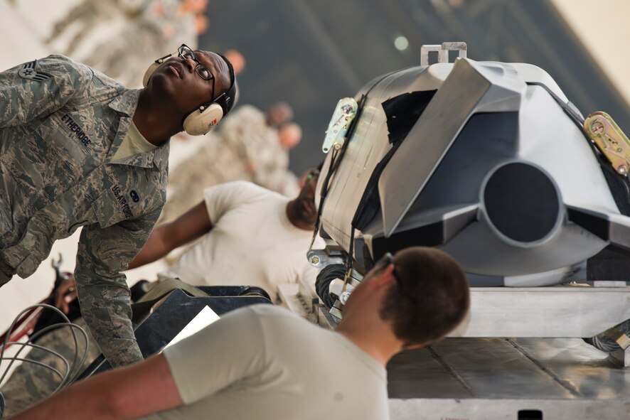 Senior Airman Jerome Ethridge, a 5th Aircraft Maintenance Squadron three man, operates the controls of a MHU-83 “Jammer” lift during the Load Crew of the Quarter competition at Minot Air Force Base, N.D., July 1, 2015. The crews were timed on their ability to load two AGM-158s onto a B-52H Stratofortress. (U.S. Air Force photo/ Airman 1st Class Justin T. Armstrong)