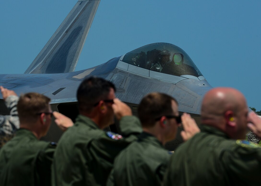 An F-22A Raptor prepares to take off for the fini flight of Brig. Gen. Kevin Huyck, 1st Fighter Wing commander, at Langley Air Force Base, Va., July 7, 2015. During his time as the commander Huyck was responsible for the worldwide rapid deployment and employment of F-22A air dominance fighters in support of combatant commander tasking’s. (U.S. Air Force photo by Senior Airman Kimberly Nagle/Released)