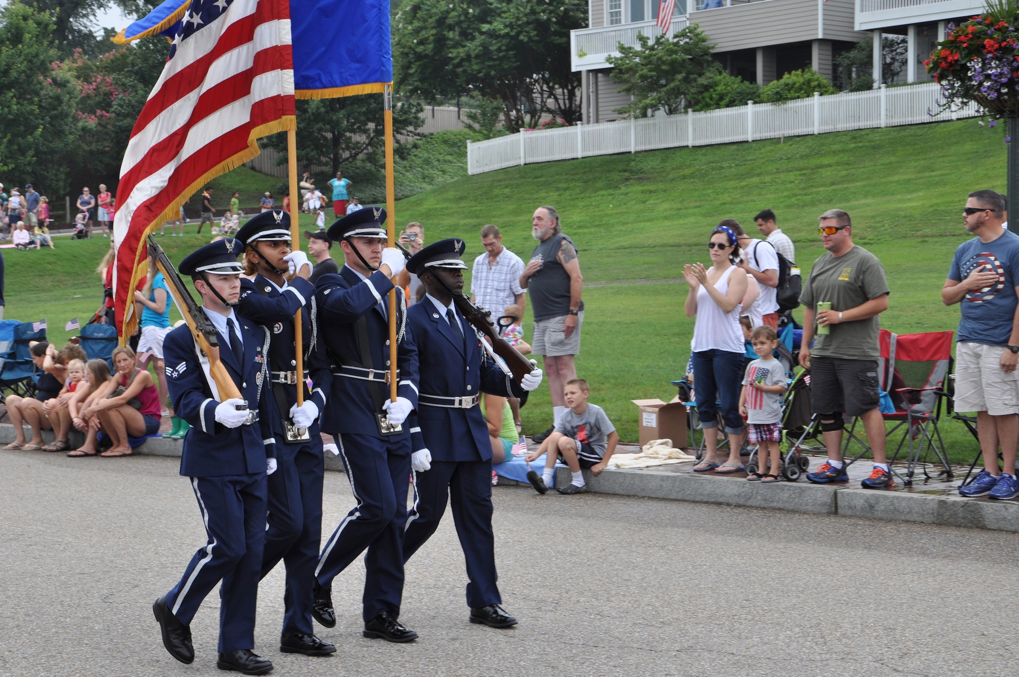 The Joint Base Langley-Eustis Air Force Base Honor Guard marches along the beachfront during the 35th Annual Fourth of July Celebration in Yorktown, Va., July 4, 2015.  The 567th Inland Cargo Transfer Company, 53rd Transportation Battalion, 7th Sustainment Brigade Expeditionary U.S. Army Color Guard also represented JBLE during the parade to celebrate America’s independence. (U.S. Air Force photo by Master Sgt. April Wickes/Released) 