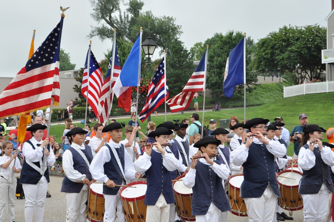 Members of the Fifes and Drums of Yorktown Junior Corps perform during the 35th Annual Fourth of July Celebration in Yorktown, Va., July 4, 2015.  The Yorktown U.S. Coast Guard Ceremonial Band provided additional parade music as color guardsmen, marching units and parade vehicles passed by spectators. (U.S. Air Force photo by Master Sgt. April Wickes/Released)