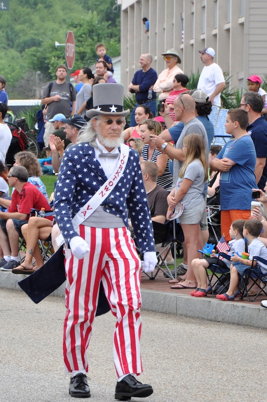 A parade participant portraying Uncle Sam marches down Water Street during the 35th Annual Fourth of July Celebration, Yorktown, Va., July 4, 2015.  Spectators also viewed color guardsmen, marching units, parade vehicles and representatives from various organizations as they passed through the crowd-lined street. (U.S. Air Force photo by Master Sgt. April Wickes/Released) 
