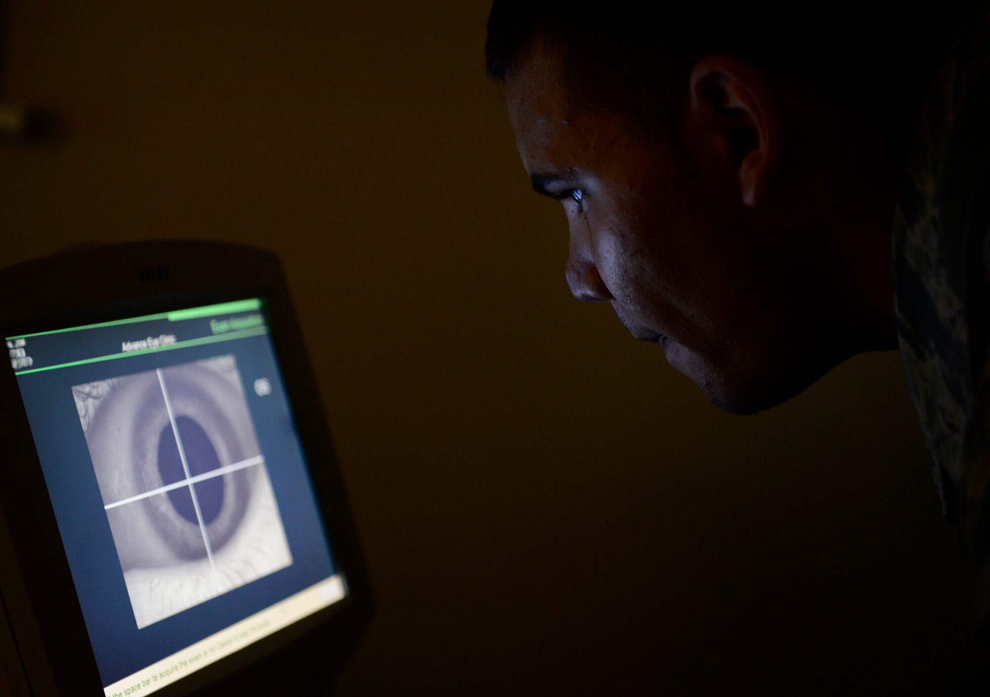 U.S. Air Force Senior Airman Joshua Nedrow, 31st Aerospace Medicine Squadron optometry technician, maps the surface curvature of a patient’s eye, July 7, 2015, at Aviano Air Base, Italy. The Aviano Optometry Clinic recommends U.S. Service members schedule yearly eye examinations to diagnose any possible issues at an early stage. (U.S. Air force photo by Senior Airman Areca T. Wilson/Released)
