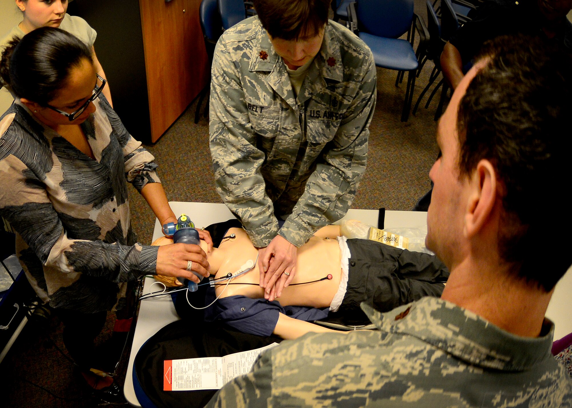 Pediatric Advanced Life Support training students practice pediatric cardiopulmonary resuscitation, July 8, 2015, at Aviano Air Base, Italy. Training includes pediatric assessment, basic life support, PALS treatment procedures, effective resuscitation and team dynamics. (U.S. Air Force photo by Senior Airman Areca T. Wilson/Released)