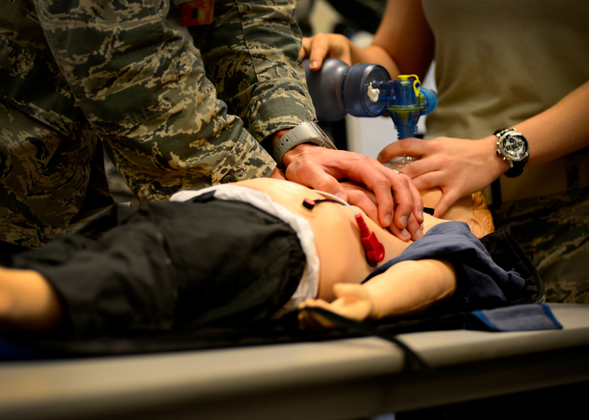 Pediatric Advanced Life Support training students practice pediatric cardiopulmonary resuscitation, July 8, 2015, at Aviano Air Base, Italy. The course trains health care professionals to provide quality care for seriously ill or injured children. (U.S. Air Force photo by Senior Airman Areca T. Wilson/Released)