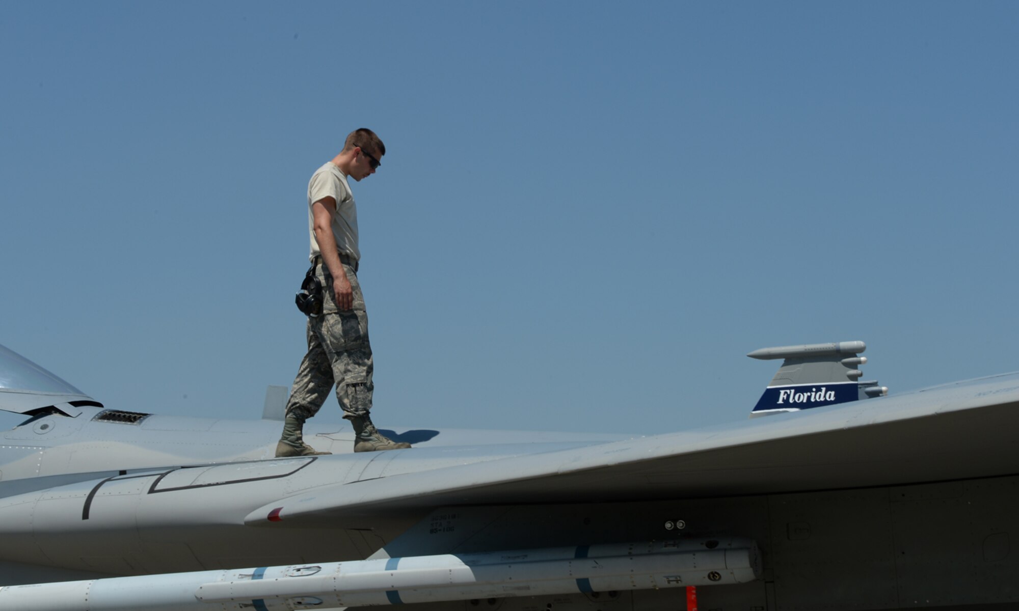 A U.S. Air National Guard crew chief from the 123rd Expeditionary Fighter Squadron performs post-flight checks on a U.S. ANG F-15C Eagle fighter aircraft during a theater security package deployment July 6, 2015, at Campia Turzii, Romania. The U.S. Air Force’s forward presence in Europe allows cooperation among NATO allies and partners to develop and improve ready air forces capable of maintaining regional security. (U.S. Air Force photo by Senior Airman Dylan Nuckolls/Released)