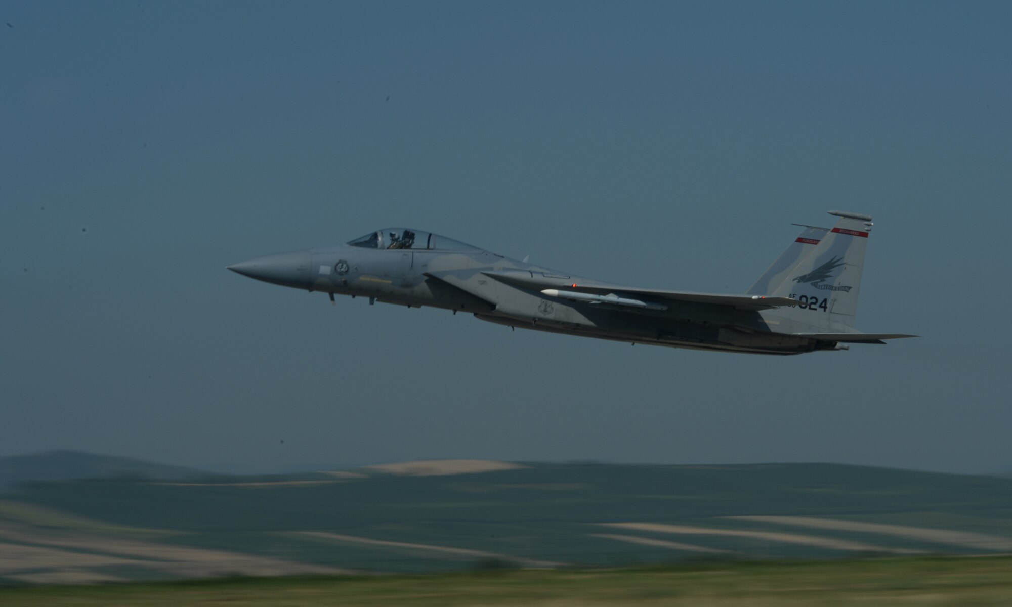 A U.S. Air National Guard F-15C Eagle fighter aircraft pilot assigned to the 123rd Expeditionary Fighter Squadron takes off from the runway July 6, 2015, at Campia Turzii, Romania. Twelve F-15Cs deployed to Romania as part of a European theater security package. (U.S. Air Force photo by Senior Airman Dylan Nuckolls/Released)