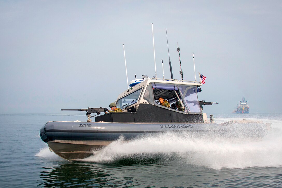 U.S. Coast Guardsmen conduct security patrols during exercise Combined Joint Logistics Over-the-Shore 2015 at Anmyeon Beach, South Korea, June 27, 2015. The Coast Guardsmen are assigned to Port Security Unit 309 in Port Clinton, Ohio.