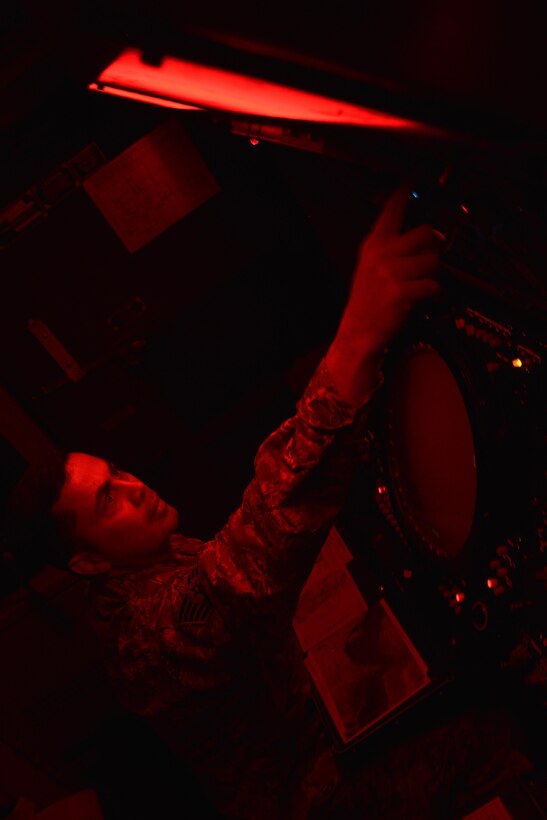 Tech. Sgt. Kermit adjusts the sensitivity controls on a planned position indicator at an undisclosed location in Southwest Asia June 29, 2015. The sensitivity controls allows the radar to detect targets and distinguish them from abnormal noise. Sgt. Kermit is a radar crew chief assigned to the Expeditionary Air Control Squadron. (U.S. Air Force photo/Tech. Sgt. Christopher Boitz)