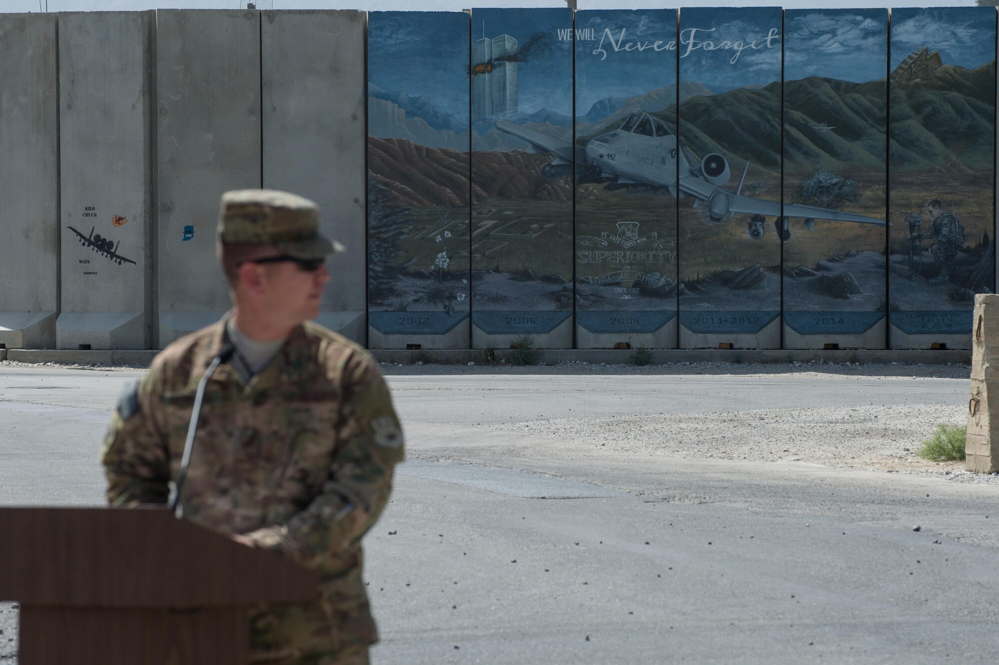 U.S. Air Force Master Sgt. Jason Bowman, 455th Expeditionary Logistics Readiness Squadron, speaks during the MSgt Randy Gillespie road dedication ceremony at Bagram Airfield, Afghanistan, July 9, 2015. Gillespie was a career fuels specialist who died July 9, 2007, from wounds sustained during small arms fire near Herat, Afghanistan. (U.S. Air Force photo by Tech. Sgt. Joseph Swafford/Released)