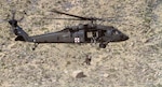 Members of the Arizona Army National Guard's Detachment 1, C Company, 5-159th Air Ambulance, conduct hoist operation training at Meteor Crater located 20 miles west of Winslow, Arizona. Recovery exercises such as this provide training and experience in recovery and medical evacuation procedures.