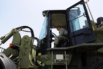 Senior Airman Daniel Dennison, 1st Special Operations Logistics Readiness Squadron vehicle operator, drives a 10K all-terrain fork lift at Hurlburt Field, Fla., July 7, 2015. The Vehicle Operations flight is composed of 35 Airmen who issue government licenses and are responsible for more than 75 vehicles used for flightline operations, cargo movement, base taxi services and temporary duty Airmen at Hurlburt Field. (U.S. Air Force photo/Senior Airman Andrea Posey)