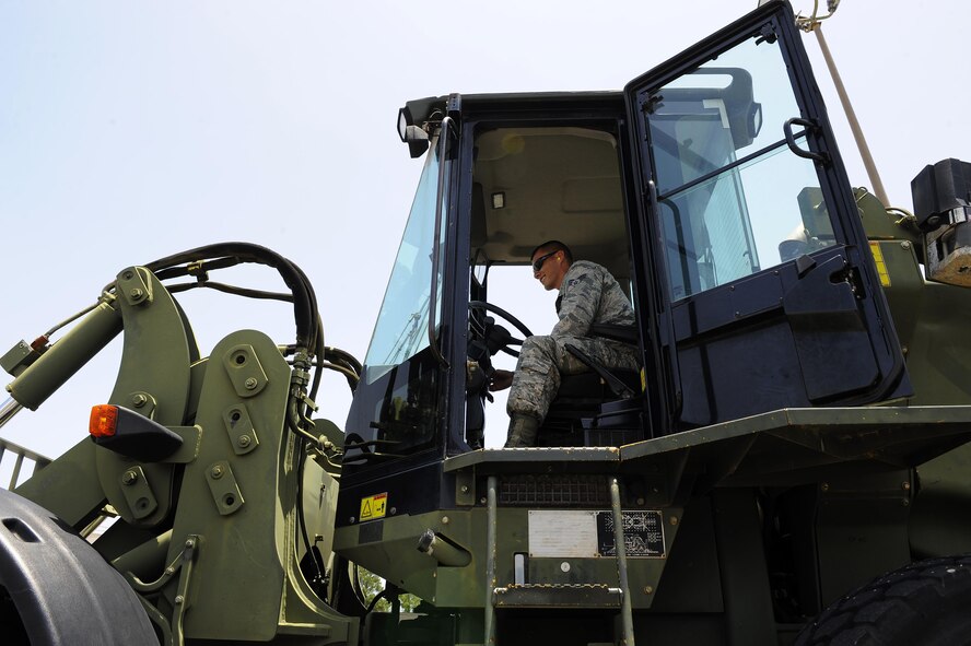 Senior Airman Daniel Dennison, 1st Special Operations Logistics Readiness Squadron vehicle operator, drives a 10K all-terrain fork lift at Hurlburt Field, Fla., July 7, 2015. The Vehicle Operations flight is composed of 35 Airmen who issue government licenses and are responsible for more than 75 vehicles used for flightline operations, cargo movement, base taxi services and temporary duty Airmen at Hurlburt Field. (U.S. Air Force photo/Senior Airman Andrea Posey)