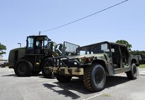 Senior Airman Daniel Dennison, 1st Special Operations Logistics Readiness Squadron vehicle operator, lifts a Humvee with a 10K all-terrain fork lift at Hurlburt Field, Fla., July 7, 2015. The Vehicle Operations flight is composed of 35 Airmen who issue government licenses and are responsible for more than 75 vehicles used for flightline operations, cargo movement, base taxi services and temporary duty Airmen at Hurlburt Field. (U.S. Air Force photo/Senior Airman Andrea Posey)