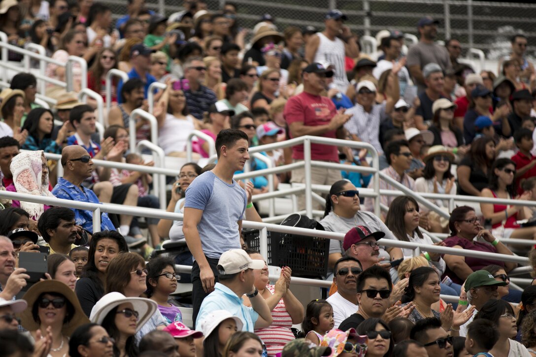 Former and current members of the military stand up at Shamu Stadium during Waves of Honor, July 4. Waves of Honor, a time SeaWorld dedicates to military members worldwide, is scheduled to be held every day in July.