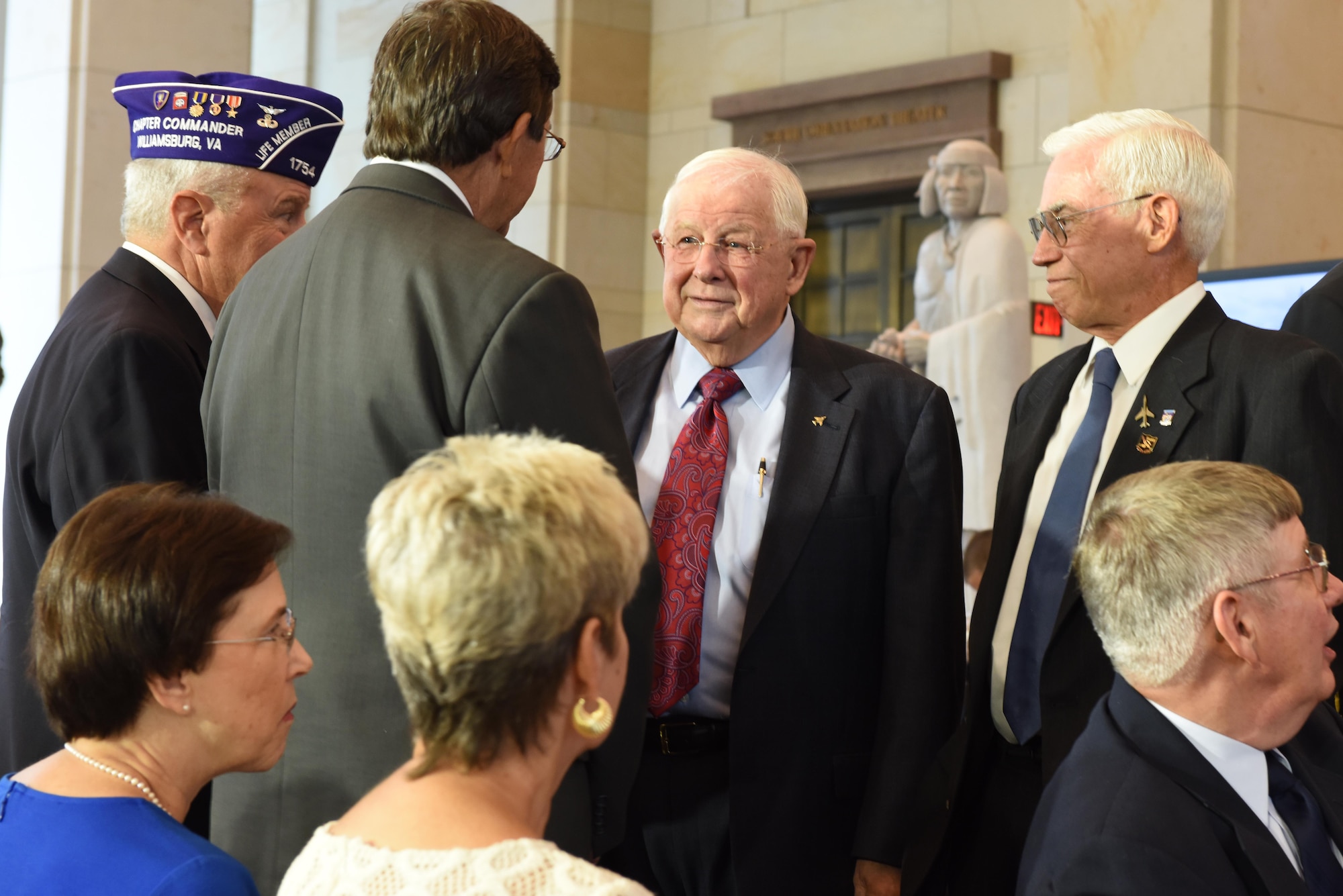 Retired Cols. William Driggers Jr. and Michael Brazelton (right) speak with other Vietnam War veterans during the Congressional Commemoration for the 50th Anniversary of the Vietnam War in the Emancipation Hall of the U.S. Capitol in Washington, July 8, 2015. (U.S. Air Force photo/Staff Sgt. Carlin Leslie)