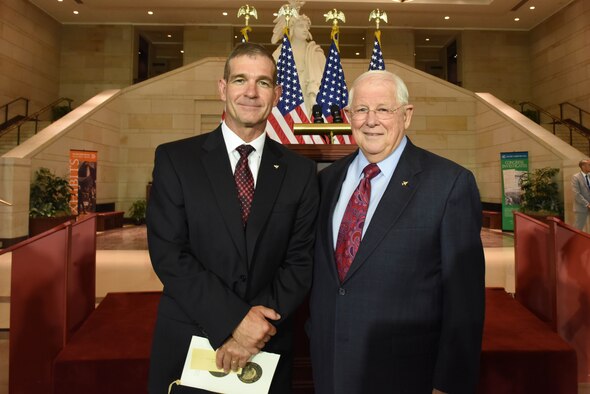 Retired Maj. Gen. Mark A. Barrett, the acting president of the Air Force Association, stands with retired Col. William Driggers Jr. at the Congressional Commemoration for the 50th Anniversary of the Vietnam War July 8, 2015, in the Emancipation Hall of the U.S. Capitol in Washington. Driggers was one of ten Vietnam veterans recognized at the congressional event. (U.S. Air Force photo/Staff Sgt. Carlin Leslie)