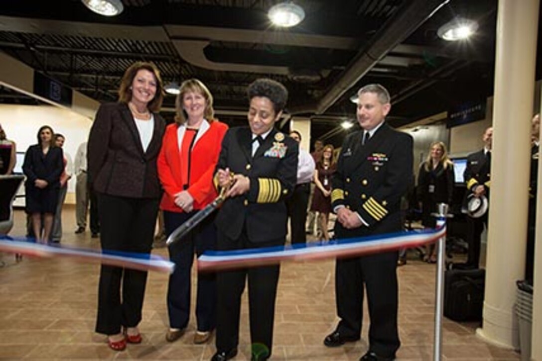 Adm. Michelle Howard, Vice Chief of Naval Operations, cuts the ribbon officially dedicating  Naval Undersea Warfare Center Division Newport's new Rapid Innovation Center during a visit April 16. With her are, from left:  Marie Bussiere, head of the Undersea Warfare Combat Systems Department, Mary Wohlgemuth, SES, division technical director, and Capt. Howard Goldman, commander of the Division.