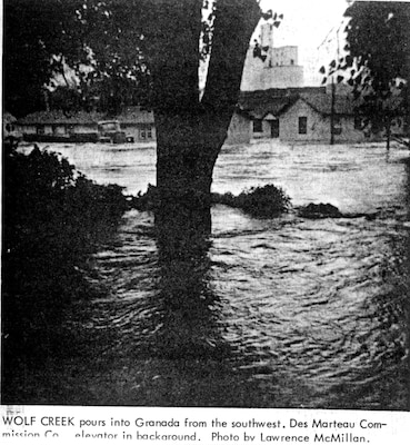 Wolf Creek pours into Granada from the southwest. Des Marteau Commission Co elevator in the background. Special thanks to the staff at John Martin Reservoir for scanning this historic photo.