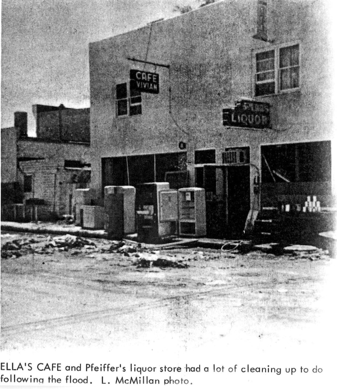 Ella's Cafe and Pfeiffer's liquor store had a lot of cleaning up to do following the flood. Special thanks to John Martin Reservoir staff for scanning this historic photo.