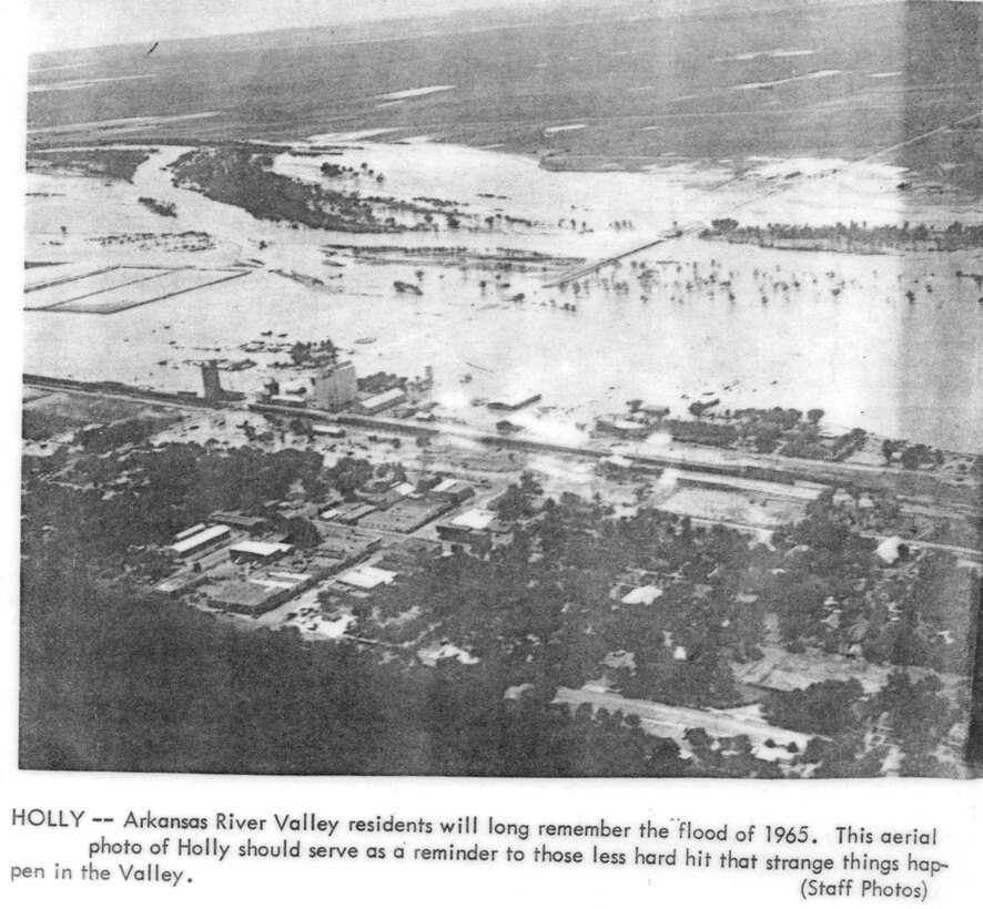 Holly - Arkansas River Valley residents will long remember the flood of 1965. This aerial photo of Holly should serve as a reminder to those less hard hit that strange things happen in the Valley.  Special thanks to John Martin Reservoir staff for scanning this historic photo.
