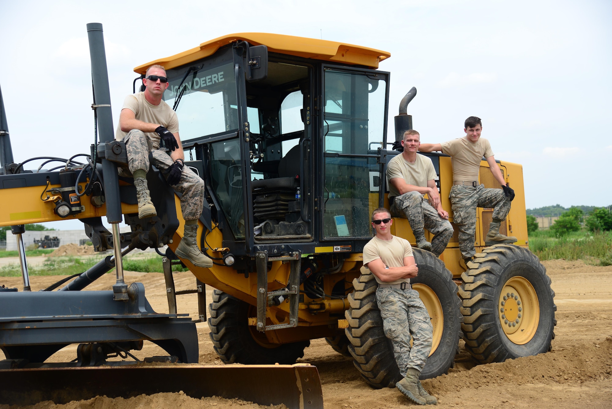 U.S. Air Force Airmen from the 51st Civil Engineer Squadron pavement and constuction shop, also known as "Dirt Boyz" are in there element at a job site on Osan Air Base, Republic of Korea, July 10, 2015. (U.S. Air Force photo by Staff Sgt. Amber Grimm/Released)