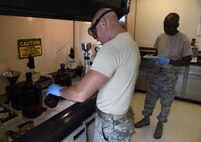 Senior Airman Johnathan Morgan, 1st Special Operations Logistics Readiness Squadron fuels laboratory technician, prepares fuel samples for lab testing at Hurlburt Field, Fla., June 25, 2015. Fuels samples and records of lab testing are maintained for quality control. (U.S. Air Force photo/Airman Kai White/Released)