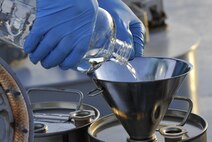 A fuel sample is stored for transportation at Hurlburt Field, Fla., June 25, 2015. For every fuel delivery, fuels Airmen conduct quality control tests to ensure the Air force is receiving the proper grade and amount of fuel. (U.S. Air Force photo /Airman Kai White/Released)