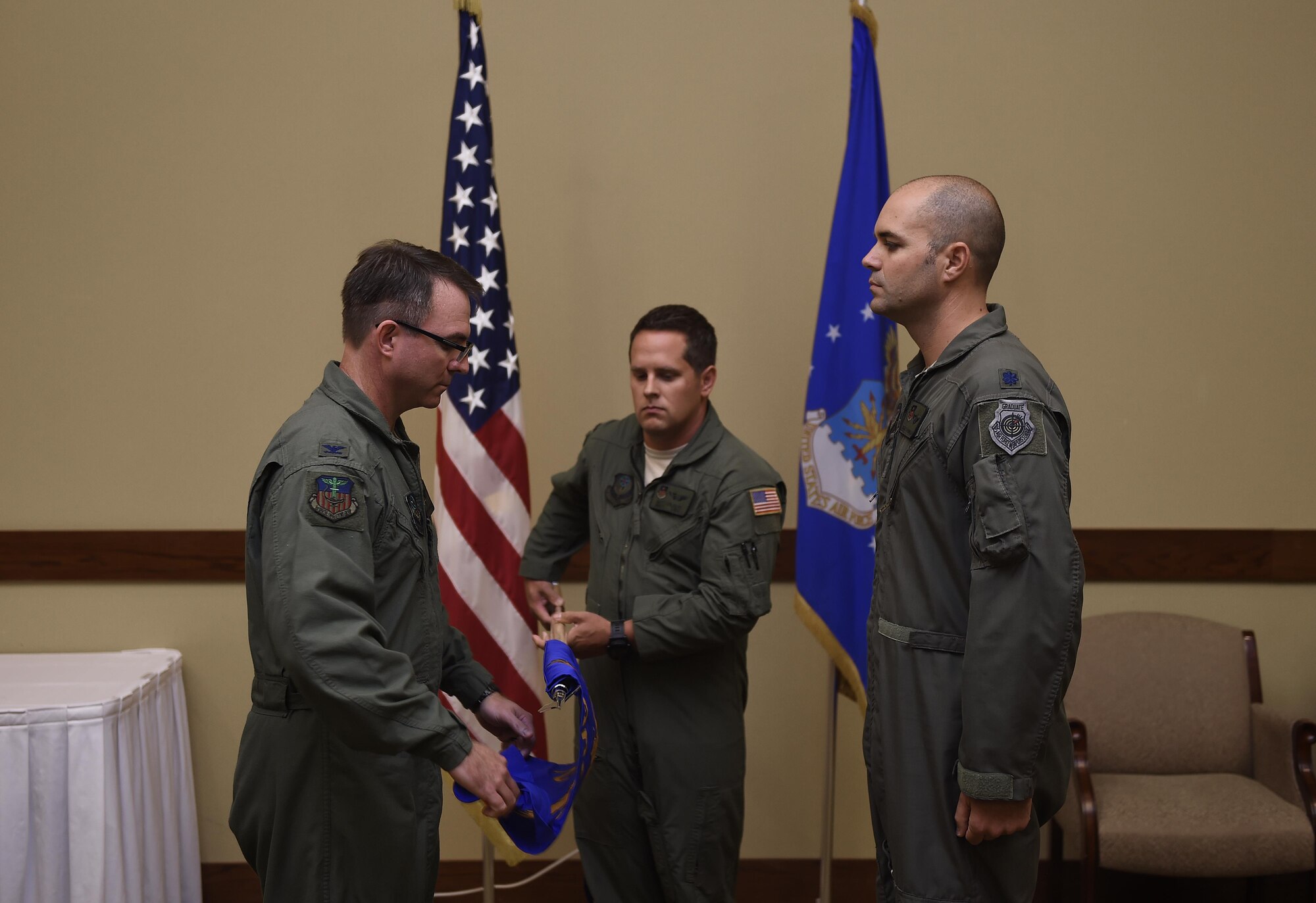 Col. Stewart Hammons, 1st Special Operations Group commander, unfurls the new Detachment 2 guidon during an activation ceremony, at Hurlburt Field, Fla., July 10, 2015. DET 2 was activated to operationally test the AC-130J Ghostrider gunship, train aircrews, as well as develop new tactics, techniques and procedures for the aircraft. (U.S. Air Force photos by Airman Kai White/Released)