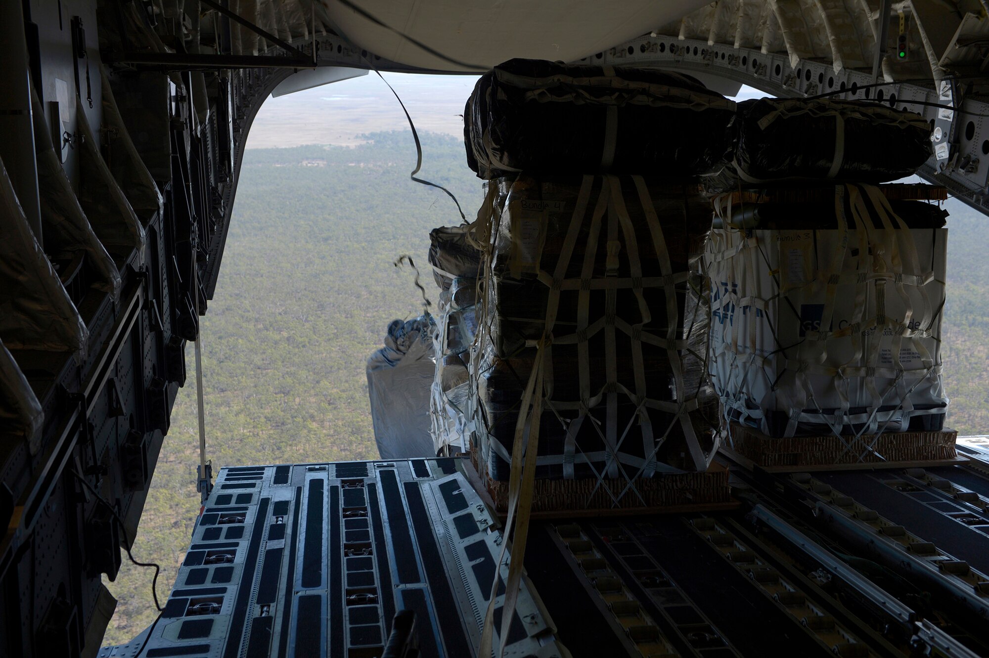 Four container delivery systems are air dropped from a U.S. Air Force C-17 Globemaster III at Exercise Talisman Sabre July 8, 2015, over Kapyon drop zone, Australia. Talisman Sabre 2015 is jointly sponsored by the U.S. Pacific Command and Australian Defence Force Headquarters Joint Operations Command. This was the first opportunity for Reserve pilots and loadmasters from the 446th OG to participate in the exercise, which now has six iterations. (U.S. Air Force photo by Tech. Sgt. Jason Robertson)