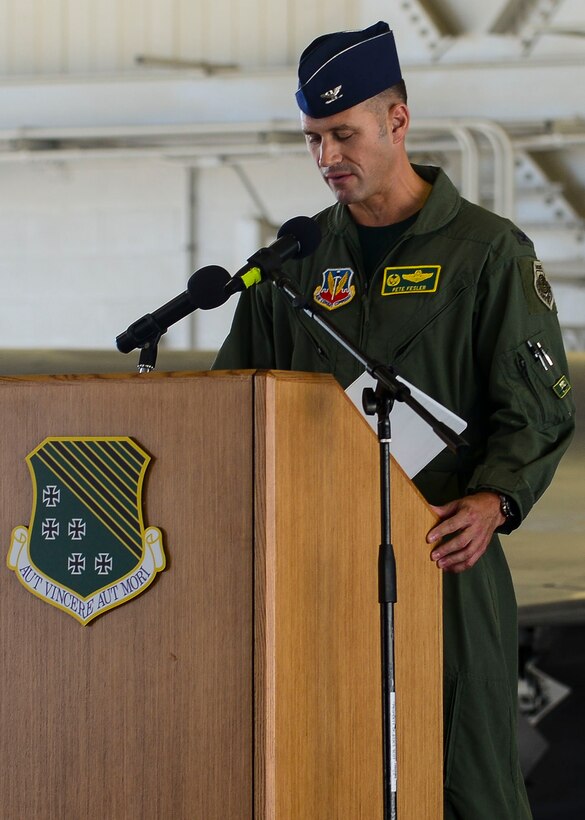 U.S. Air Force Col. Pete Fesler, 1st Fighter Wing incoming commander, speaks during the 1st FW change of command ceremony at Langley Air Force Base, Va., July 10, 2015. Fesler, a Youngstown, Ohio, native, will now command more than 1,400 personnel in his new role.  (U.S. Air Force photo by Senior Airman Kimberly Nagle/Released)  