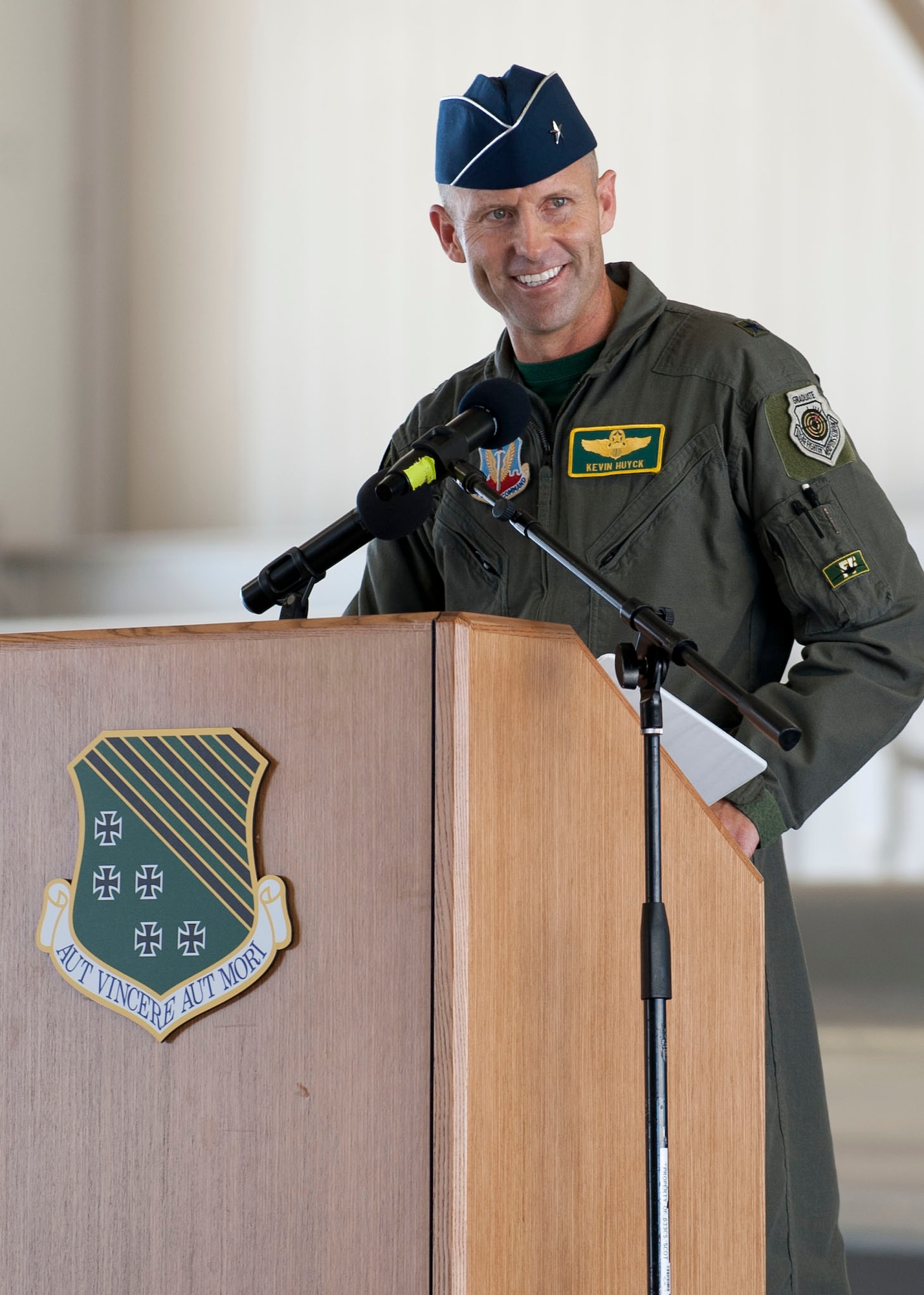 U.S. Air Force Brig. Gen. Kevin A. Huyck, 1st Fighter Wing outgoing commander, addresses the crowd during the 1st FW change of command ceremony at Langley Air Force Base, Va., July 10, 2015. During his time at the 1st FW, Huyck oversaw 1,400 personnel, two airfields, two groups and six squadrons, including two F-22A fighter squadrons and a T-38 Adversary Air Detachment. (U.S. Air Force photo by Staff Sgt. John D. Strong II/Released)
