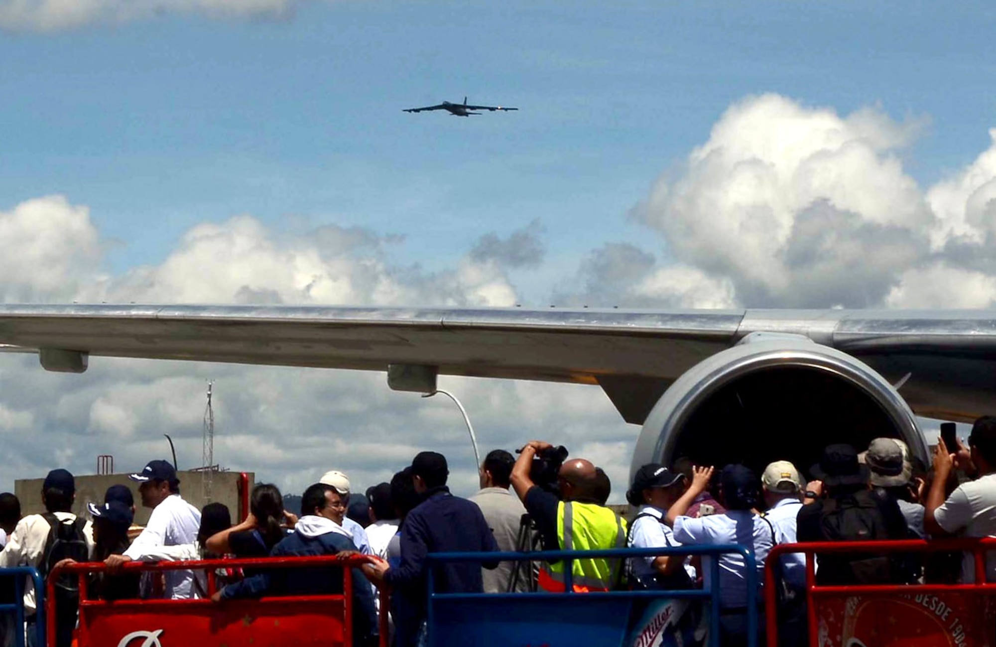 A crowd watches the arrival of a U.S. Air Force B-52 Stratofortress at the Jose Maria Cordova International Airport during a flyover demonstration at the Colombian International Air Festival, July 9, 2015 in Rionegro, Colombia. The aircraft took off from its home station at Minot Air Force Base, N.D., to conduct a 16-hour, long-range training mission which included the flyover in Colombia. The B-52 Stratofortress is a long-range strategic aircraft capable of traveling 8,800 miles before refueling. (U.S. Air Force photo by MSgt. Kristina Newton/Released)