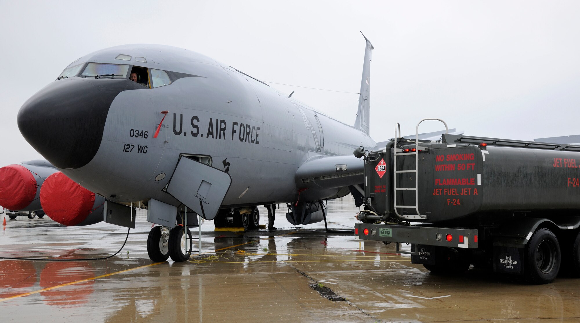 A KC-135 Stratotanker is refueled on the flightline at Selfridge Air National Guard Base, Mich., July 9, 2015. Fully loaded, a KC-135 can hold up to 203,000 pounds of fuel. On a typical, day the average load is around 40,000 pounds or 5,900 gallons of fuel. The amount of fuel a jet receives is dependent on what the mission requires. (U.S. Air National Guard Photo by Senior Airman Ryan Zeski/Released)