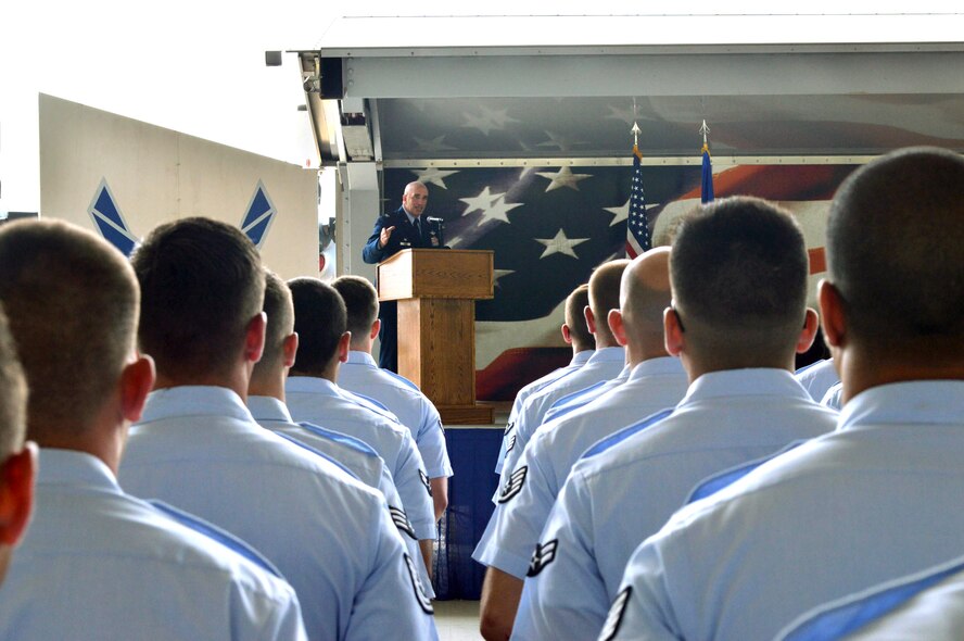Col. Kenneth Moss, 43rd Airlift Group commander, addresses attendees during the 43rd Air Mobility Squadron activation ceremony July 1, 2015, at Pope Army Airfield, North Carolina. Aircraft maintenance and aerial port Airmen and functions transferred to the newly established 43rd AMS from the inactivated 3rd Aerial Port Squadron and the 43rd Aircraft Maintenance Squadron. (U.S. Air Force photo/Marvin Krause)
