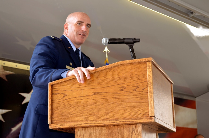 Col. Kenneth Moss, 43rd Airlift Group commander, addresses attendees during the 43rd Air Mobility Squadron activation ceremony July 1, 2015, at Pope Army Airfield, North Carolina. Aircraft maintenance and aerial port Airmen and functions transferred to the newly established 43rd AMS from the inactivated 3rd Aerial Port Squadron and the 43rd Aircraft Maintenance Squadron. (U.S. Air Force photo/Marvin Krause)