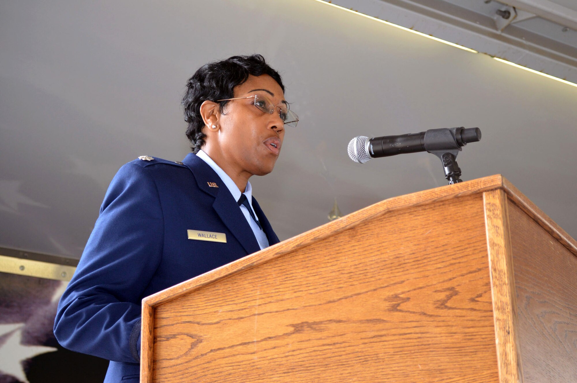 Lt. Col. Kimberly Wallace, 43rd Air Base Squadron commander, provides remarks to Airmen of the 43rd ABS and guests, after assuming command of the 43rd ABS July 1, 2015, during the 43rd ABS redesignation and change of command ceremony at Pope Army Airfield, North Carolina. Logistics and force support Airmen and functions transferred to the newly established squadron from the inactivated 43rd Logistics Readiness Squadron and the 43rd Force Support Squadron. (U.S. Air Force photo/Marvin Krause)