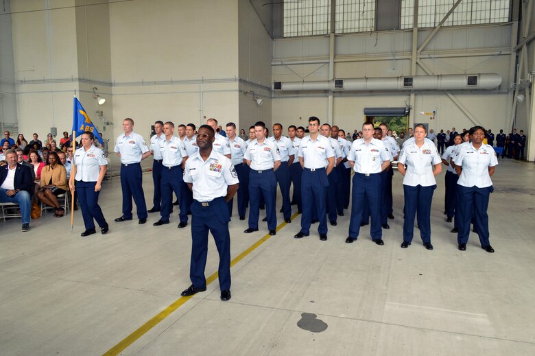 Chief Master Sgt. Johnny Brown, 43rd Air Base Squadron superintendent, leads logistics and force support Airmen who stand in formation together to form the new 43rd Air Base Squadron during the 43rd ABS redesignation and change of command ceremony July 1, 2015, at Pope Army Airfield, North Carolina. The 43rd Logistics Readiness Squadron and 43rd Force Support Squadron were inactivated and cased their guidons during the ceremony. (U.S. Air Force photo/Marvin Krause)