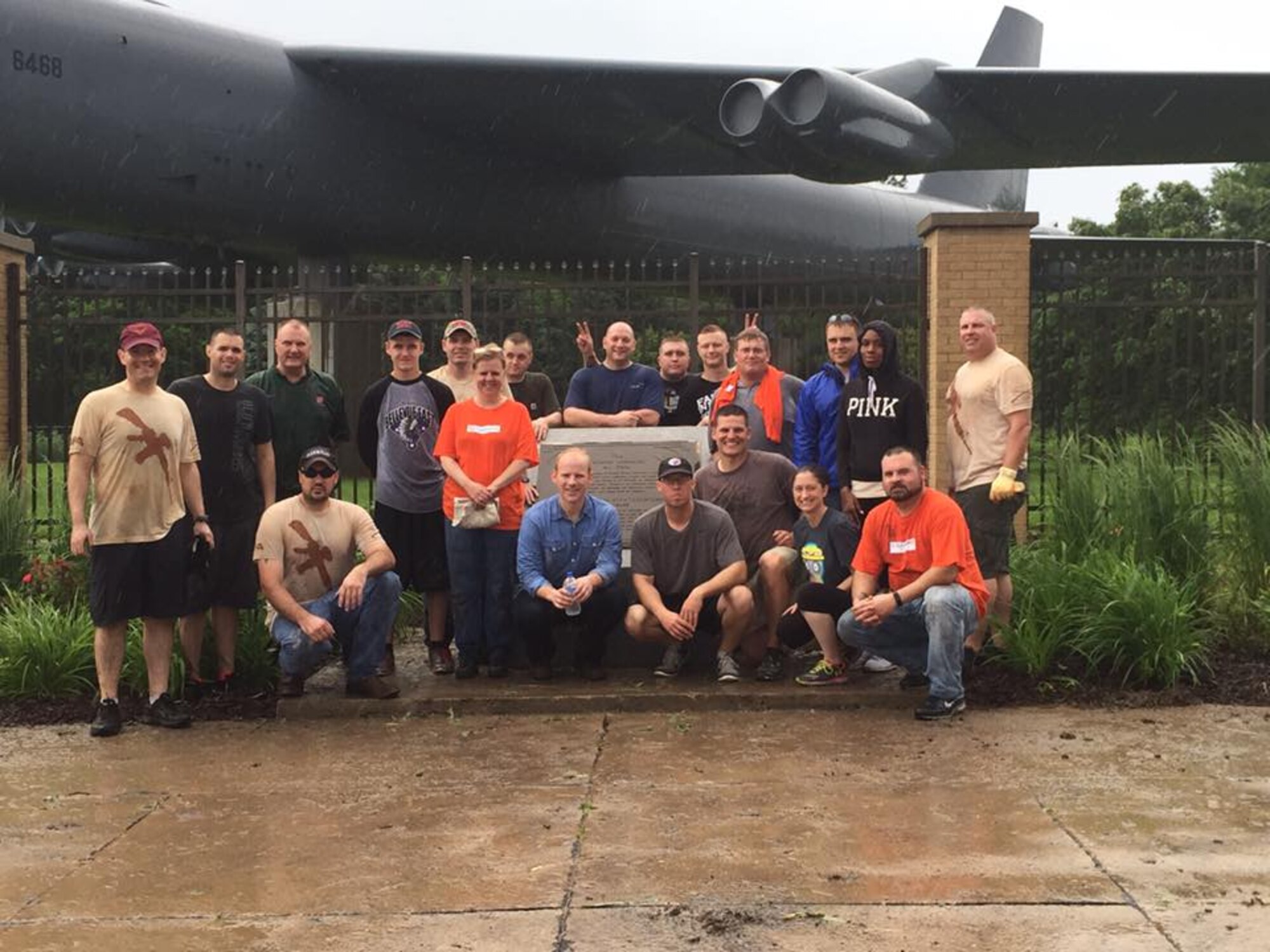 Members of the Security Forces Association, the 55th Security Forces Squadron’s booster club, pose with employees of Home Depot after they came together recently to beautify the Kenney Gate. They team cleaned out flower beds, pulled weeds and trimmed bushes. (Courtesy photo)