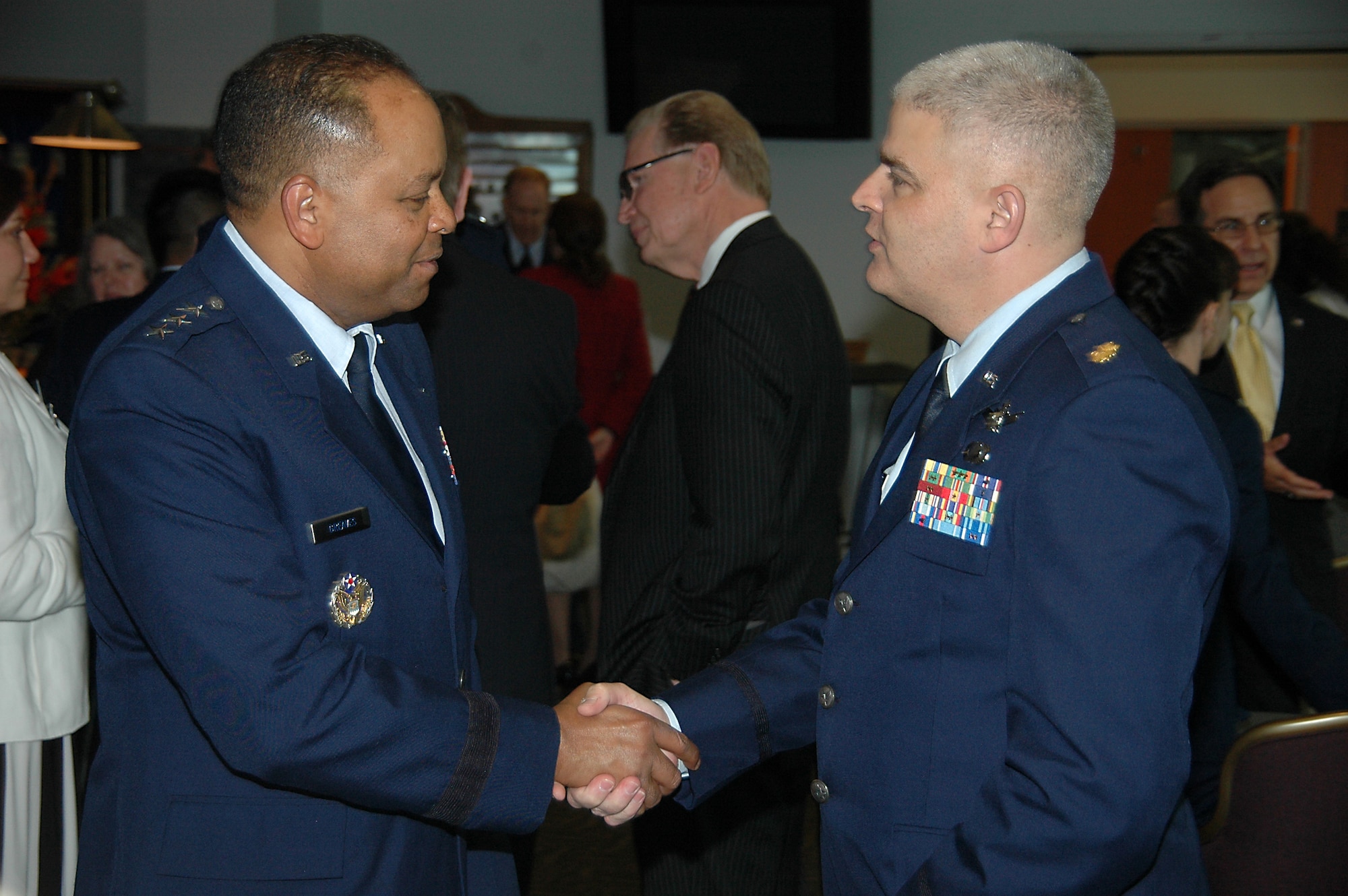 Lt. Gen. Samuel Greaves, Space and Missile Systems Center commander meets with Maj. Michael Schriever after a ceremony honoring six early Air Force and civilian space pioneers whose newly inscribed names were unveiled at the General Bernard A. Schriever Memorial, located at Los Angeles Air Force Base in El Segundo, Calif. Maj. Schriever is the grandson of General Schriever and chief of the National Reconnaissance Office headquarters Weapons and Tactics and deputy chief of NRO Special Technical Operations. (U.S. Air Force photo/James Spellman, Jr.)