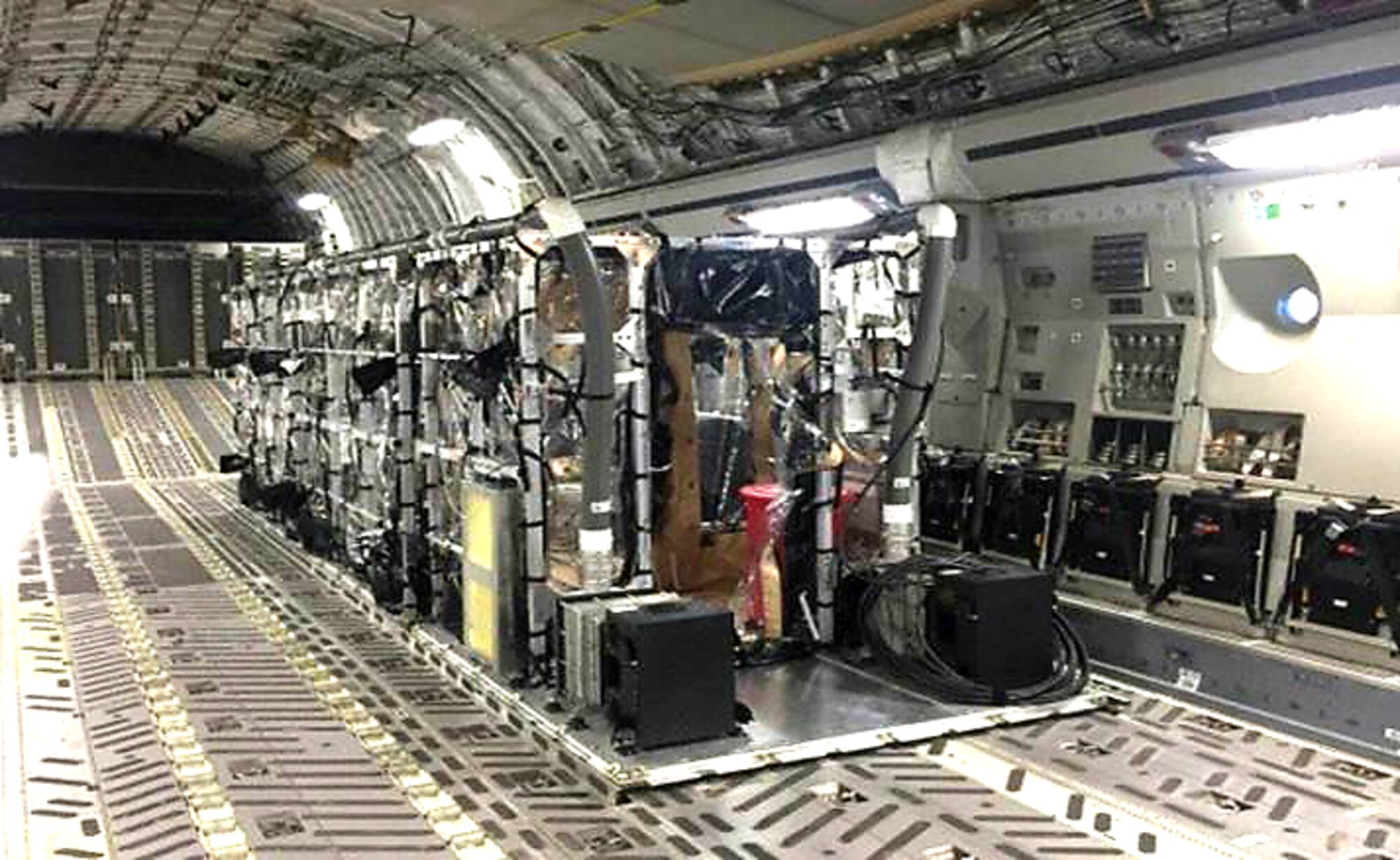 A Transportation Isolation System loaded onboard a C-17 Globemaster III. The system can be used to transport multiple patients with highly contagious diseases such as Ebola and SARS. (U.S. Air Force Photo/Released)