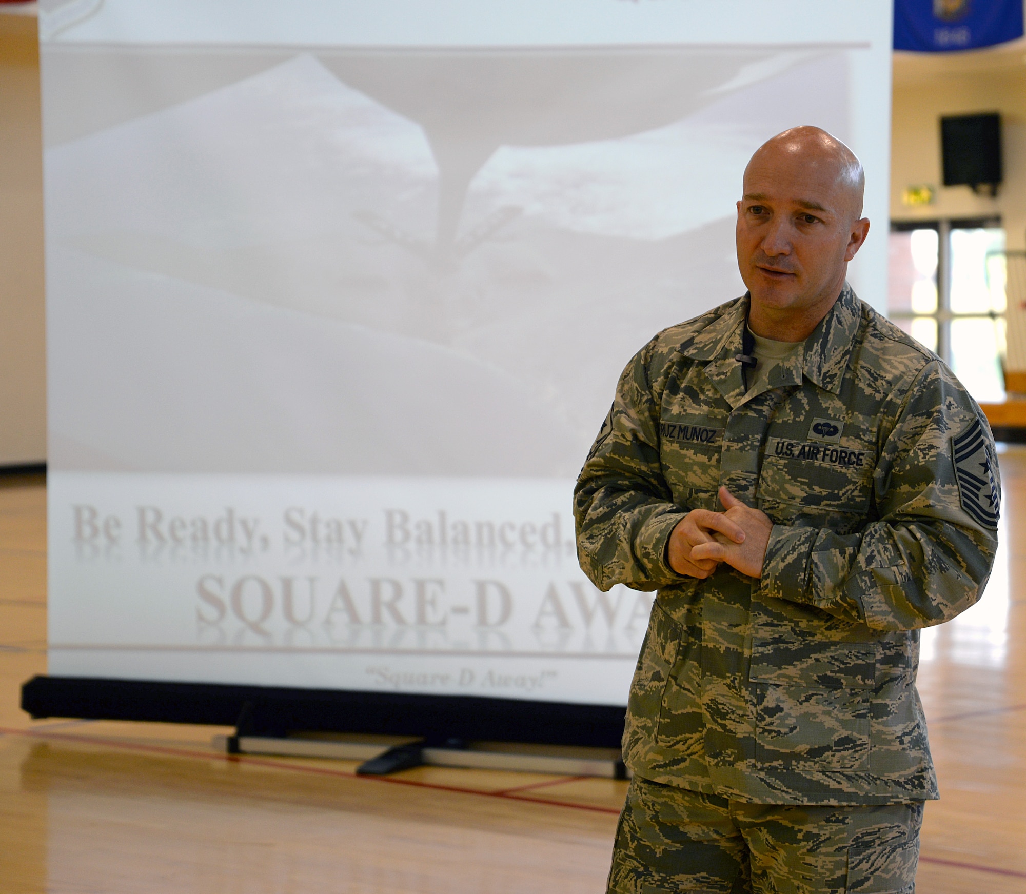U.S. Air Force Chief Master Sergeant Anthony Cruz-Munoz, 100th Air Refueling Wing command chief, answers an Airman’s question during his first enlisted call July 9, 2015, on RAF Mildenhall, England. Cruz-Munoz gave Team Mildenhall Airmen a better understanding of who he is and his expectations as command chief. (U.S Air Force photo by Senior Airman Christine Halan/Released)