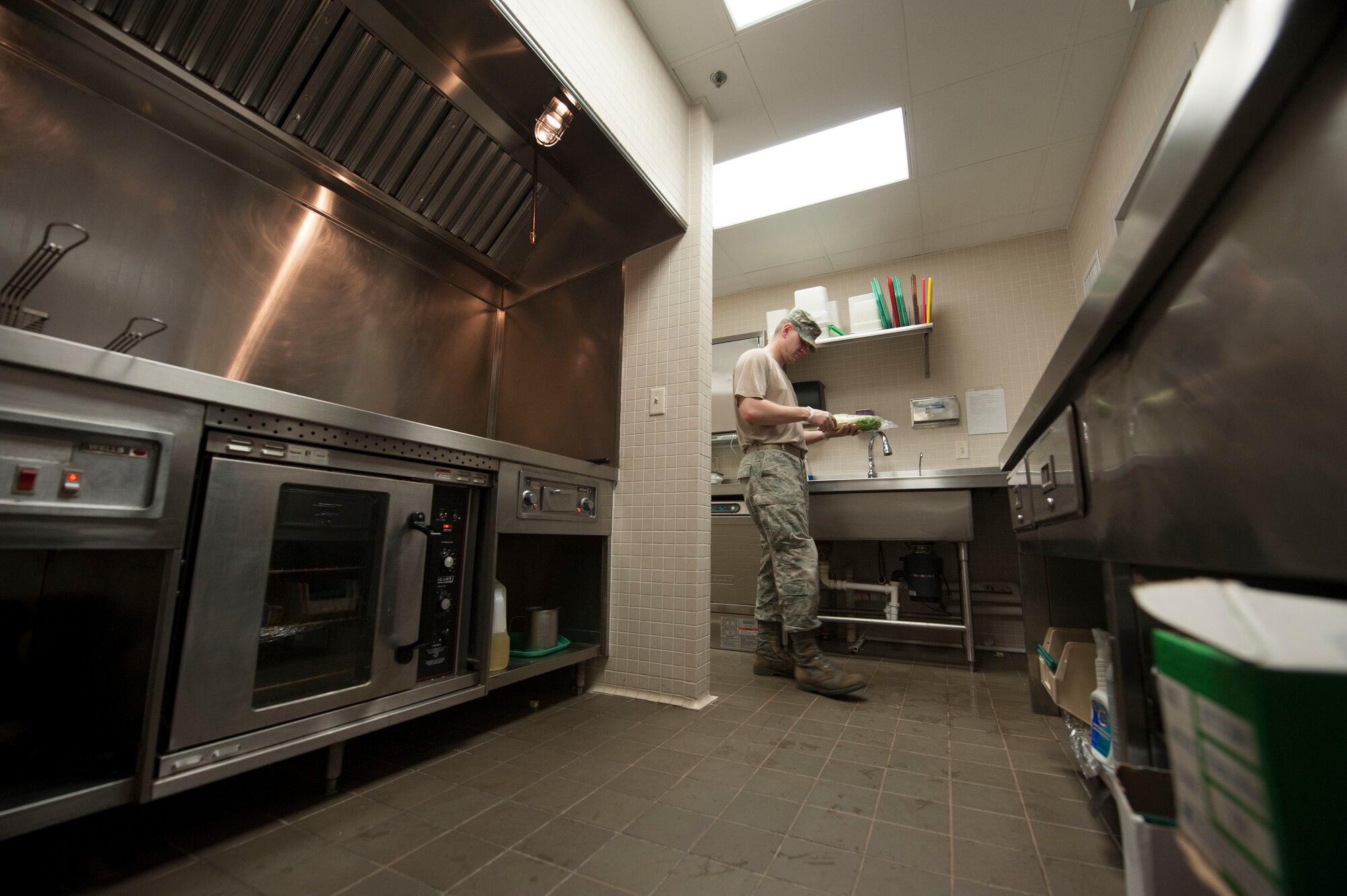 Staff Sgt. Ryan Patriok, 5th Force Support Squadron missile chef, inspects the kitchen at the Bravo 01 Missile Alert Facility, July 1, 2015. Inspections are conducted at shift change over and before and after each meal to ensure sanitary working conditions and proper food storage are maintained. (U.S. Air Force photo/Senior Airman Stephanie Morris)