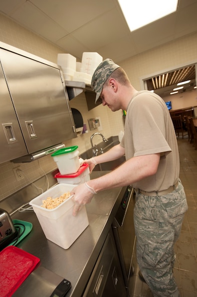 Staff Sgt. Ryan Patriok, 5th Force Support Squadron missile chef, prepares ingredients for stir-fry at the Bravo 01 Missile Alert Facility, July 1, 2015. Missile chefs follow recipe cards for meals that outline portion sizes and ingredient measurements and also add their personal flare to presentation and flavor. (U.S. Air Force photo/Senior Airman Stephanie Morris)