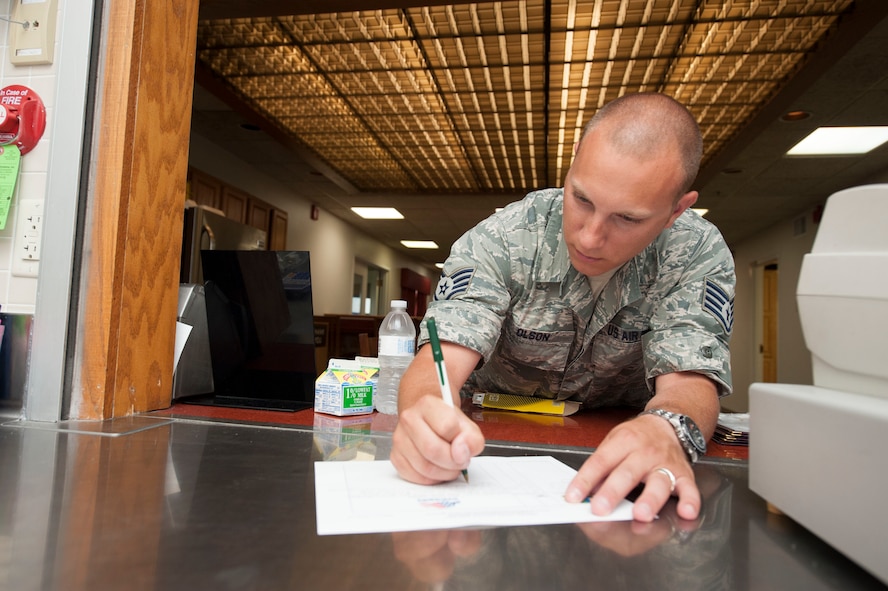 Staff Sgt. Derrick Olson, 740th Missile Squadron facility manager, writes down his meal order at the Bravo 01 Missile Alert Facility, July 1, 2015. MAF kitchens offer a variety of food choice for each meal including items for breakfast, lunch, dinner and snacks. (U.S. Air Force photo/Senior Airman Stephanie Morris)