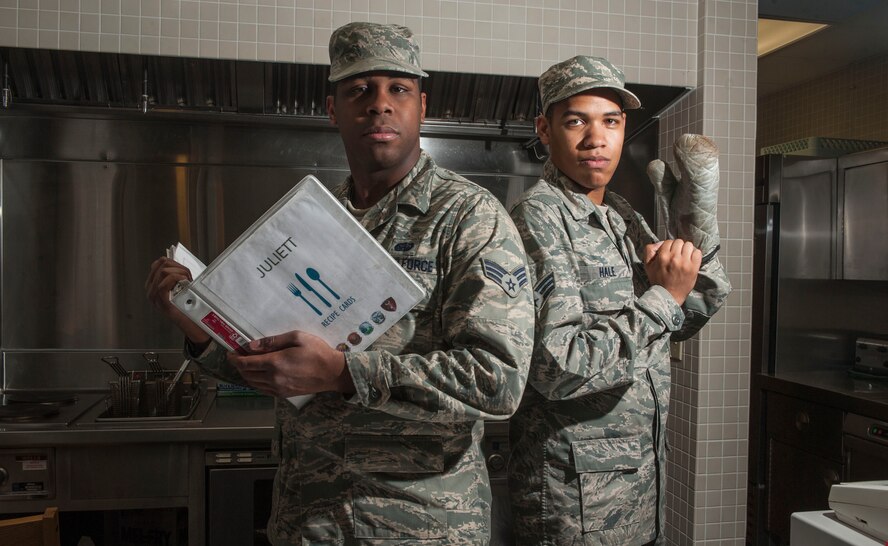 Senior Airman Larry Covington (left), and Senior Airman Stephen Hale, 5th Force Support Squadron missile chefs, pose for a photo at the Juliet 01 Missile Alert Facility, June 22, 2015. In addition to their regular shifts, missile chefs are also expected to remain on standby in case they are needed to replace another chef who is unable to fulfill their duties. (U.S. Air Force photo/Senior Airman Stephanie Morris)