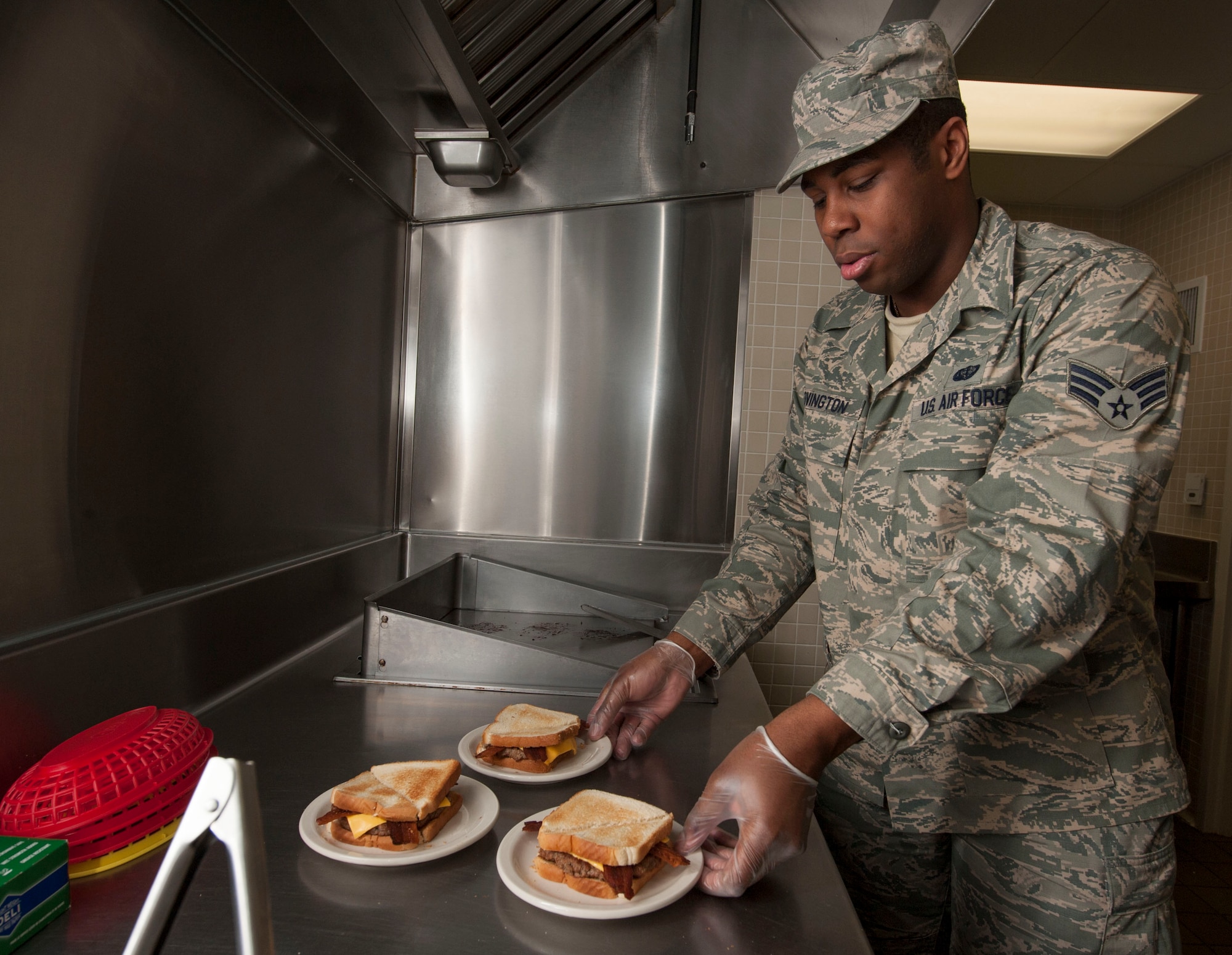 Senior Airman Larry Covington, 5th Force Support Squadron missile chef, prepares lunch at the Juliet 01 Missile Alert Facility, June 22, 2015. Covington has been working in the missile complex for two years and recently received the designation of trainer. (U.S. Air Force photo/Senior Airman Stephanie Morris)
