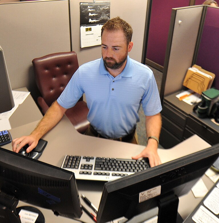 Bryan Canady, Air Force Life Cycle Management Center contracting specialist, performs his job while standing at the computer. Several of Canady’s coworkers have adopted this type workplace arrangement for its health benefits. (U.S. Air Force photo by Tommie Horton)