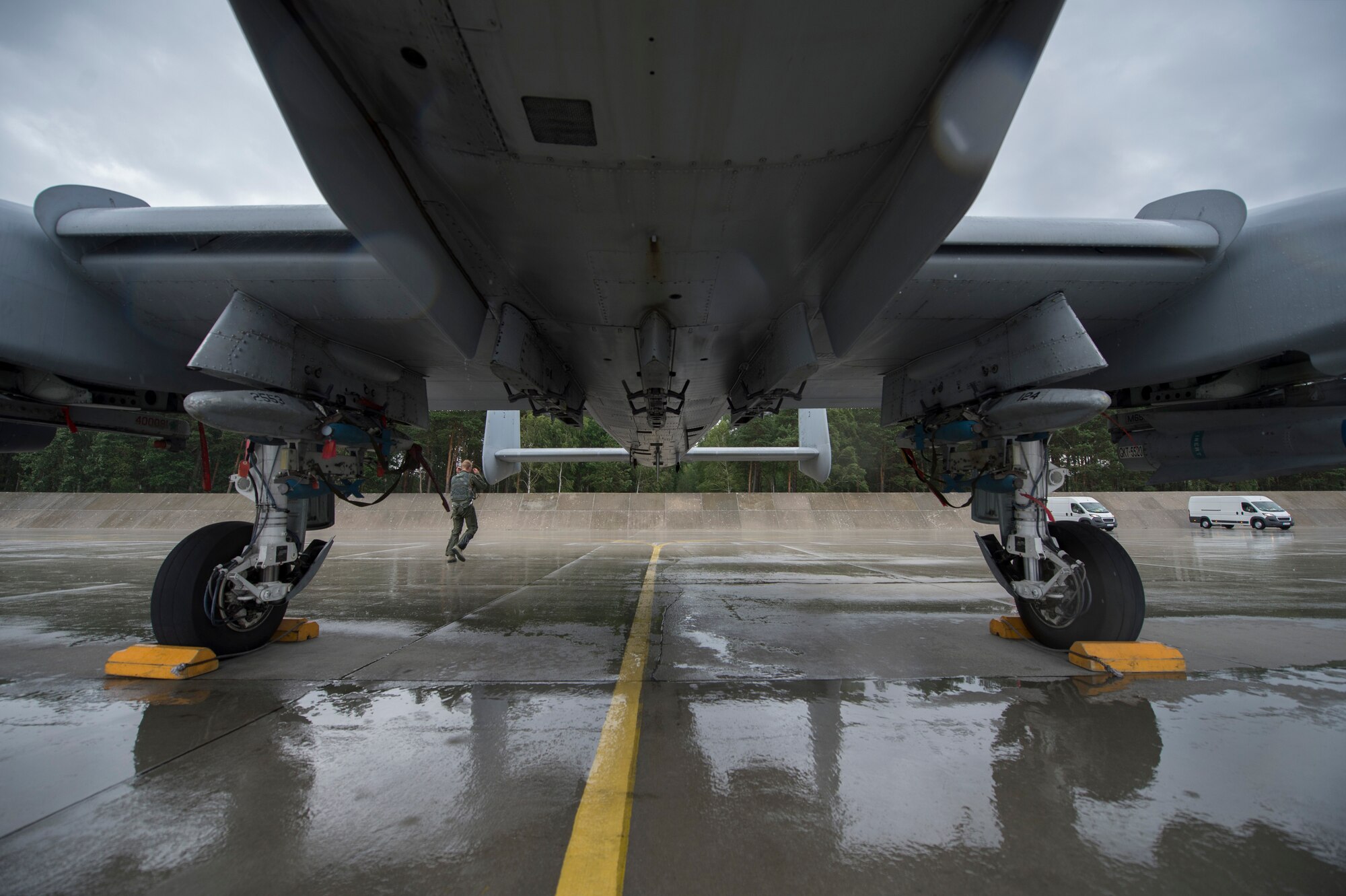 A U.S. Air Force 354th Expeditionary Fighter Squadron A-10 Thunderbolt II attack aircraft pilot performs a walk-around before flight during a theater security package deployment at Lask Air Base, Poland, July 9, 2015. Pilots and crew chiefs perform pre- and post-flight inspections on the aircraft to ensure it is safe to fly. (U.S. Air Force photo by Staff Sgt. Christopher Ruano/Released)