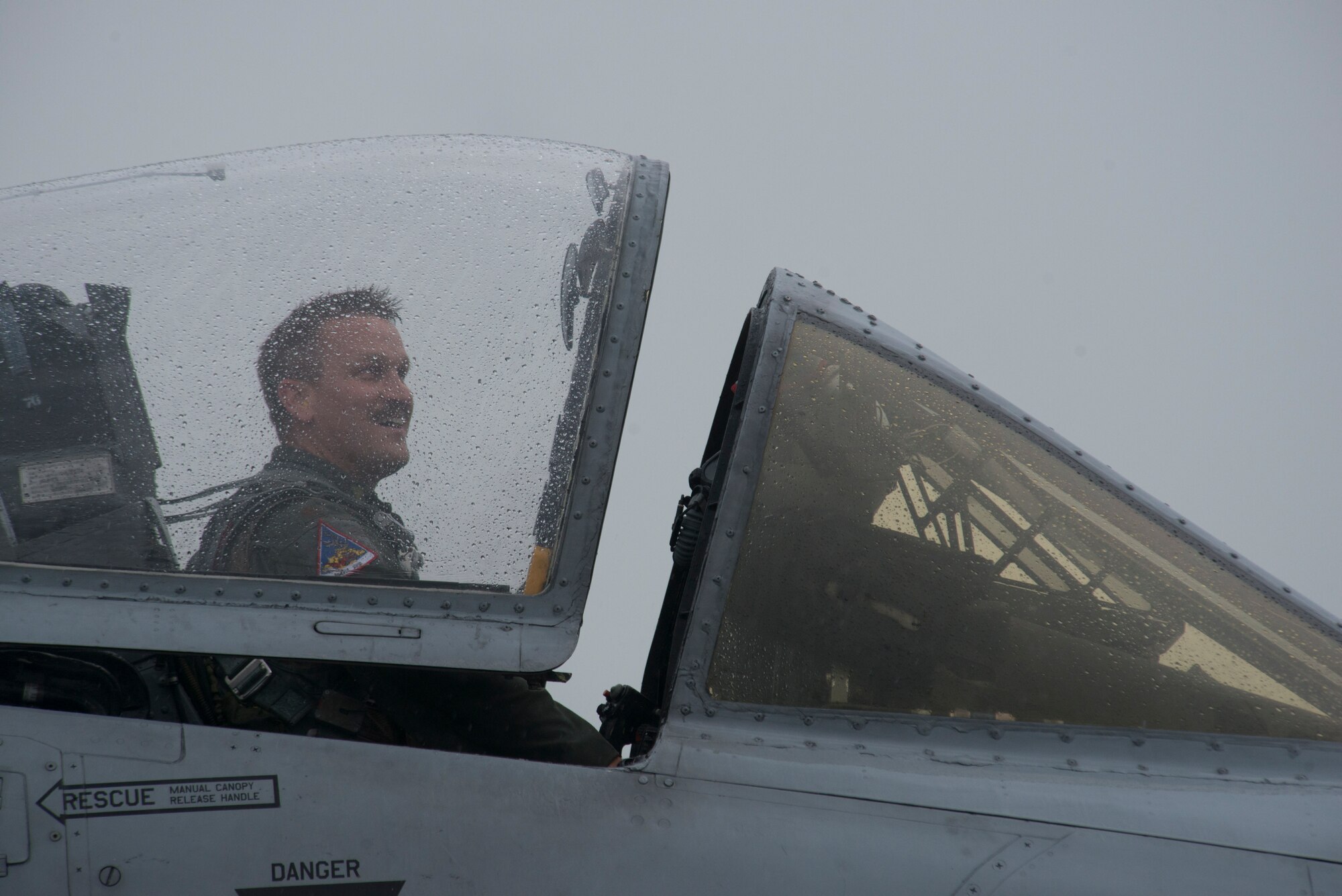 A U.S. Air Force 354th Expeditionary Fighter Squadron A-10 Thunderbolt II attack aircraft pilot closes the canopy of the aircraft during a theater security package deployment at Lask Air Base, Poland, July 9, 2015. The pilots will conduct training alongside NATO allies to strengthen interoperability and demonstrate U.S. commitment to the security and stability of Europe. (U.S. Air Force photo by Staff Sgt. Christopher Ruano/Released)