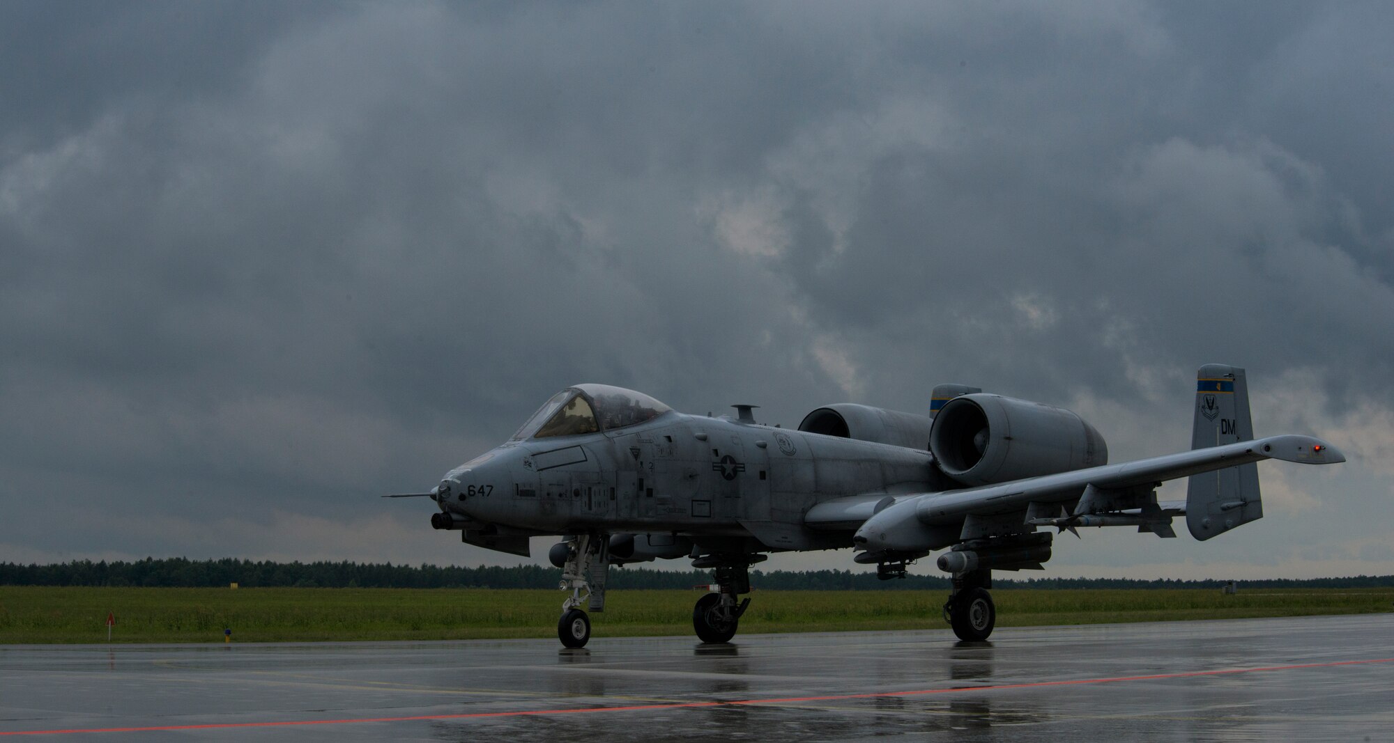 A U.S. Air Force A-10 Thunderbolt II attack aircraft pilot assigned to the 354th Expeditionary Fighter Squadron taxis to the runway during a theater security package deployment to Lask Air Base, Poland, July 9, 2015. The pilots will conduct training alongside NATO allies to strengthen interoperability and demonstrate U.S. commitment to the security and stability of Europe. (U.S. Air Force photo by Staff Sgt. Christopher Ruano/Released)